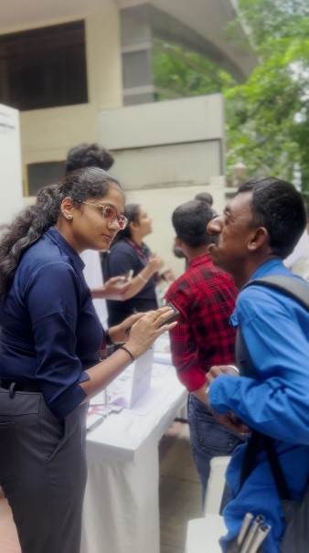 Student volunteers assisting physically challenged candidates at the Job Habba job fair.
